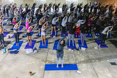 Students participate in a yoga class.